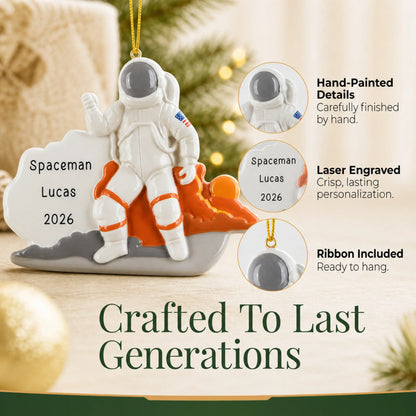 Hand-painted details and laser engraved personalization on the astronaut christmas ornament, ribbon included