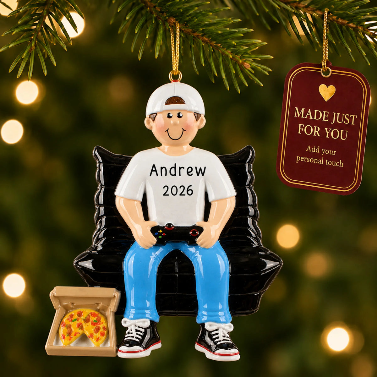 Gamer boy christmas ornament hanging on a lit Christmas tree with a Made Just For You gift tag