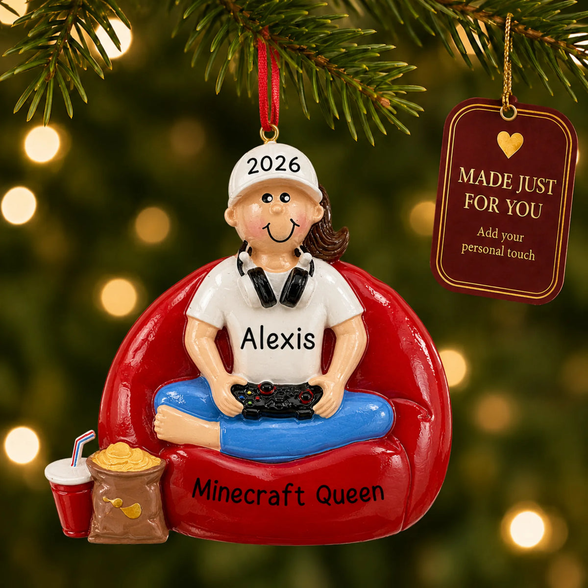 Gamer girl christmas ornament hanging on a lit Christmas tree with a Made Just For You gift tag