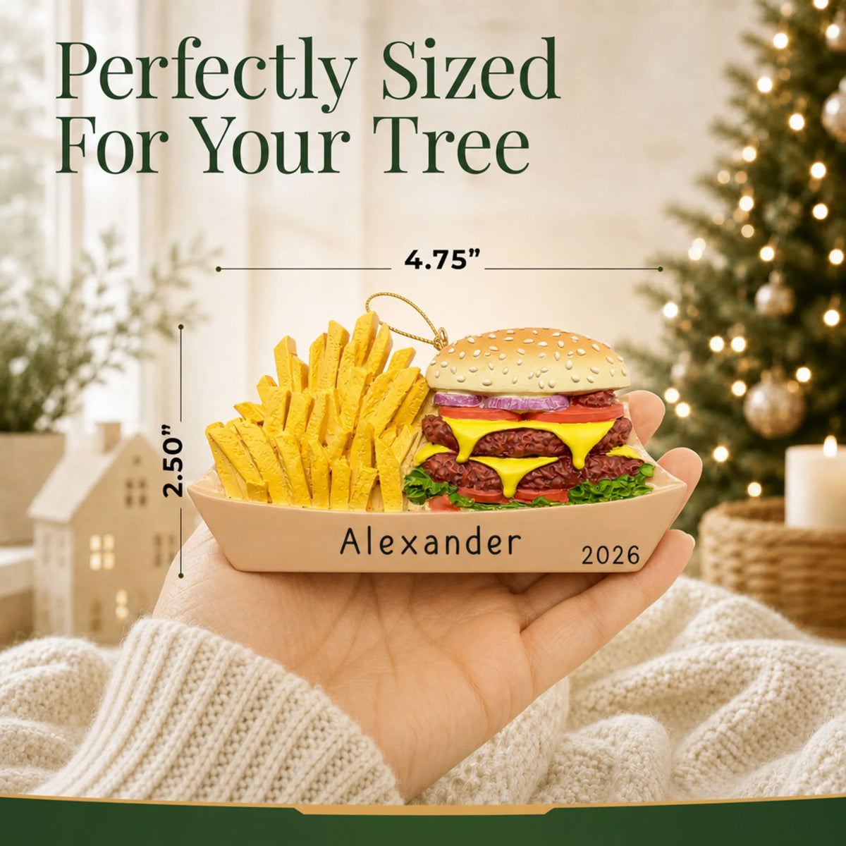 Size guide: the personalized Burger & Fries christmas ornament is 4.75 in wide by 2.50 in tall, shown in hand