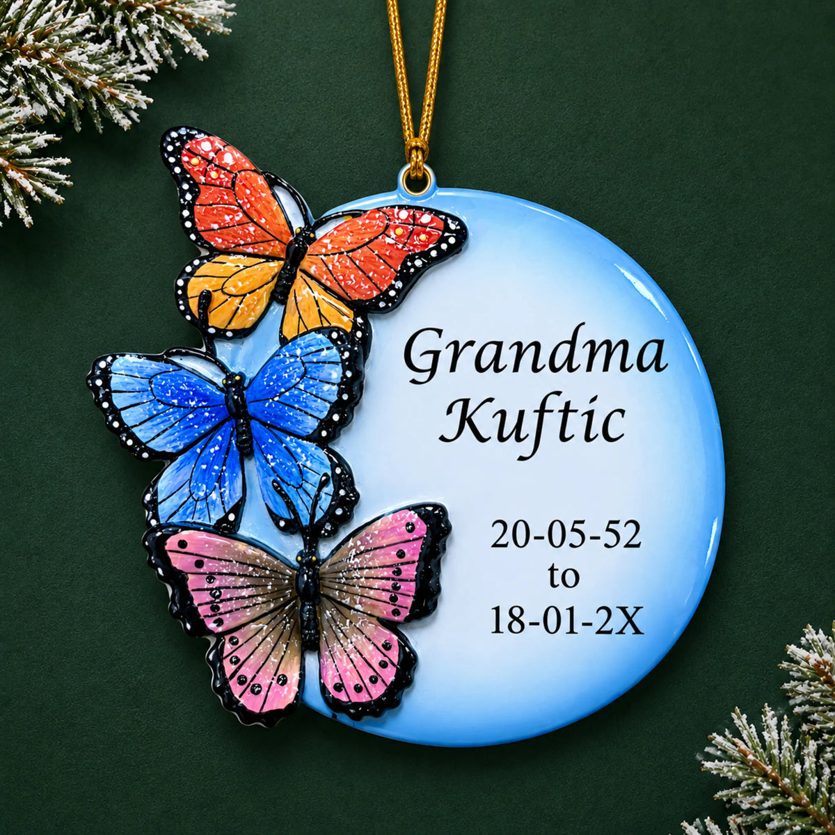 Personalized Butterfly Memorial christmas ornament on a dark green pine background