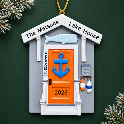 Personalized Lake House christmas ornament on a dark green pine background