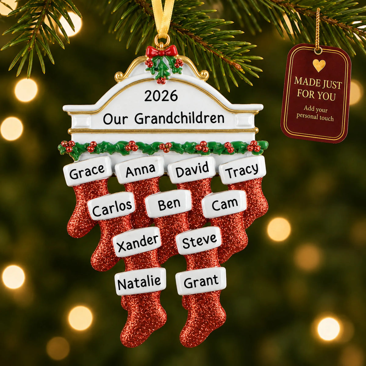 Red stockings family of 11 christmas ornament hanging on a lit Christmas tree with a Made Just For You gift tag