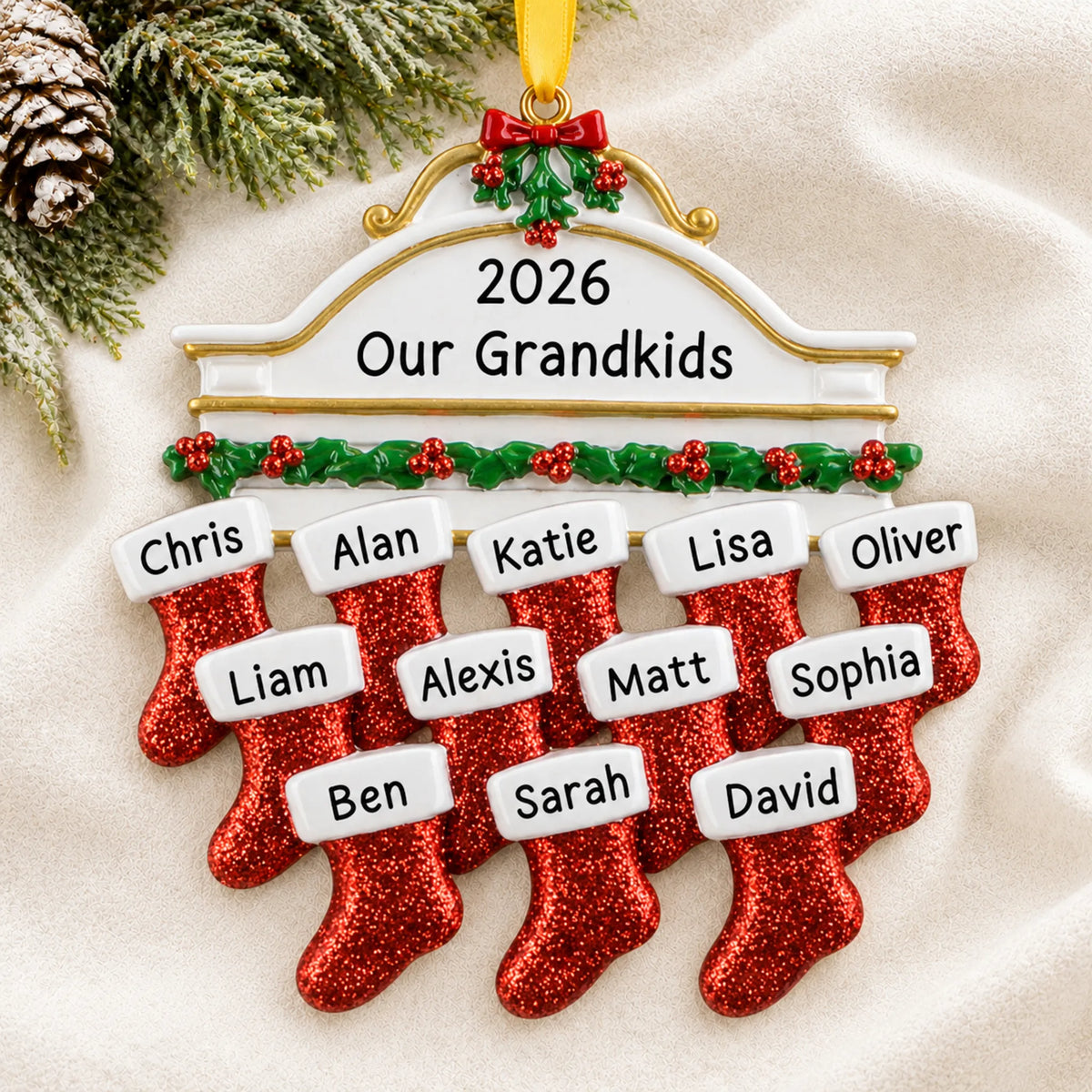 Personalized red stockings family of 12 christmas ornament laid on a soft white knit blanket