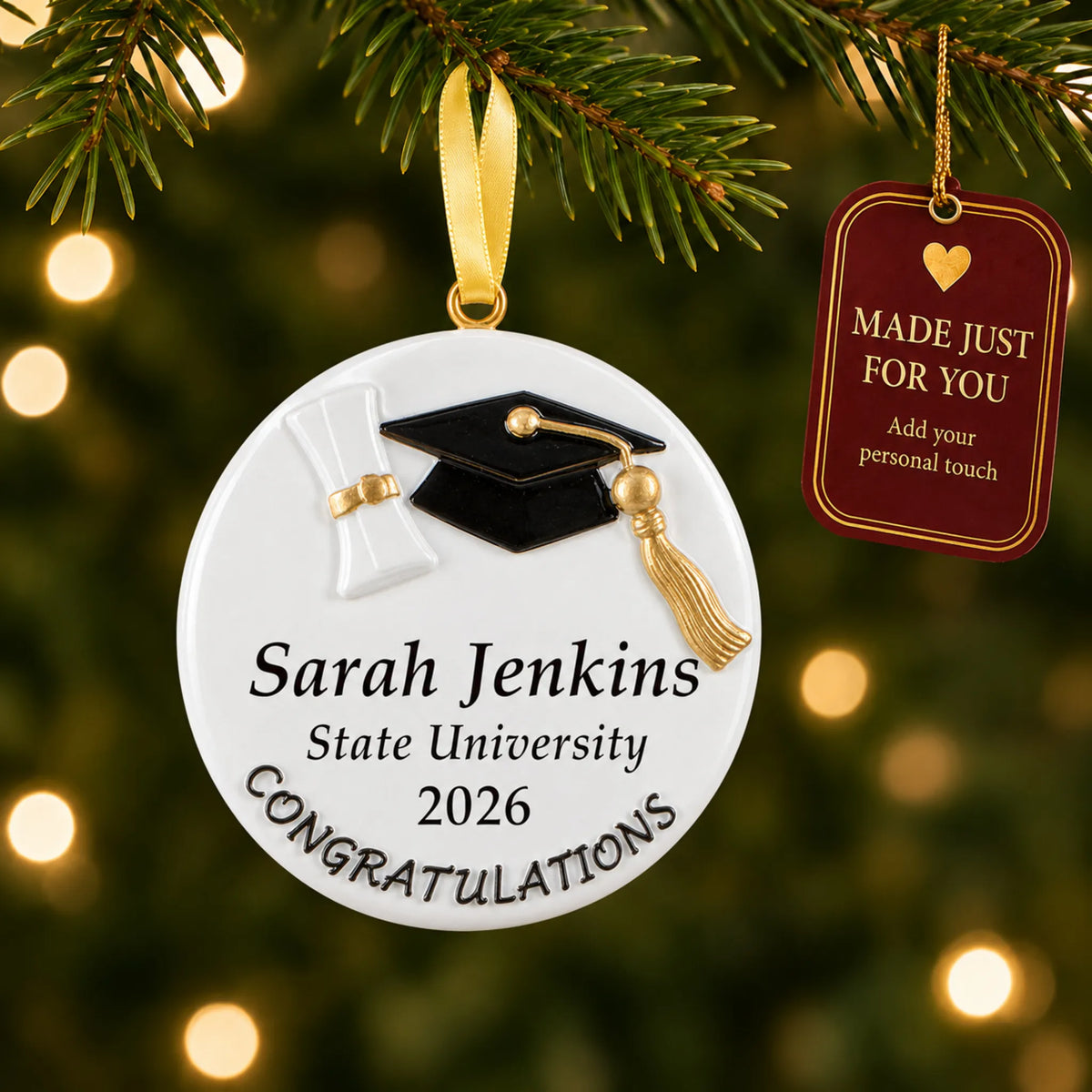 Personalized graduation congratulations Christmas ornament on a lit tree with a made-just-for-you tag