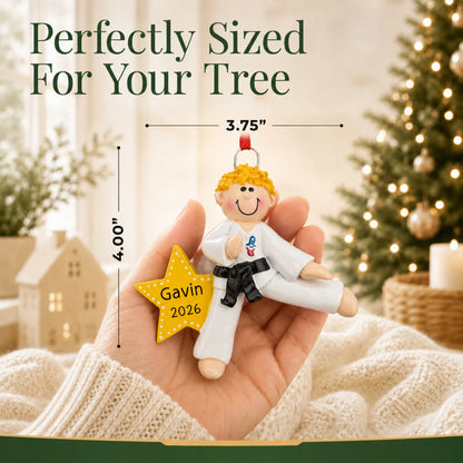 Size guide: the personalized blonde karate MMA guy christmas ornament is 3.75 in wide by 4.00 in tall, shown in hand