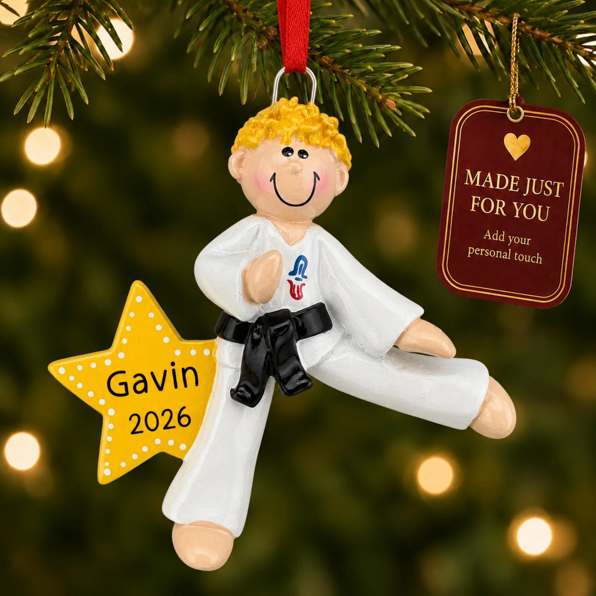 Blonde karate MMA guy christmas ornament hanging on a lit Christmas tree with a Made Just For You gift tag