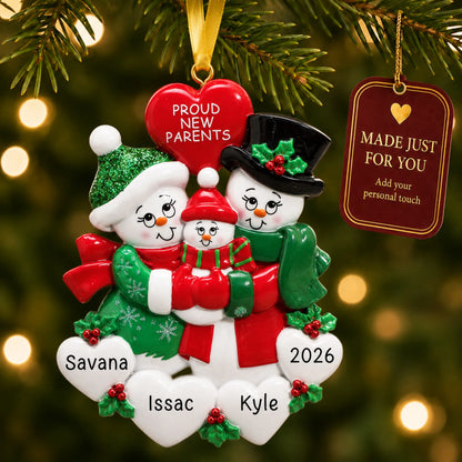 New parents snowman christmas ornament hanging on a lit Christmas tree with a Made Just For You gift tag