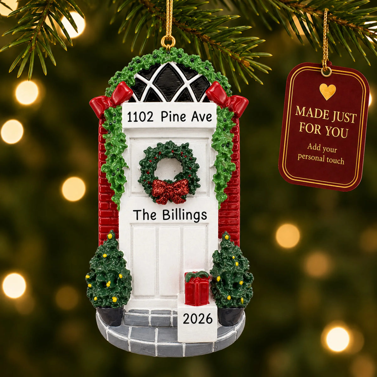 Holiday White Door christmas ornament hanging on a lit Christmas tree with a Made Just For You gift tag