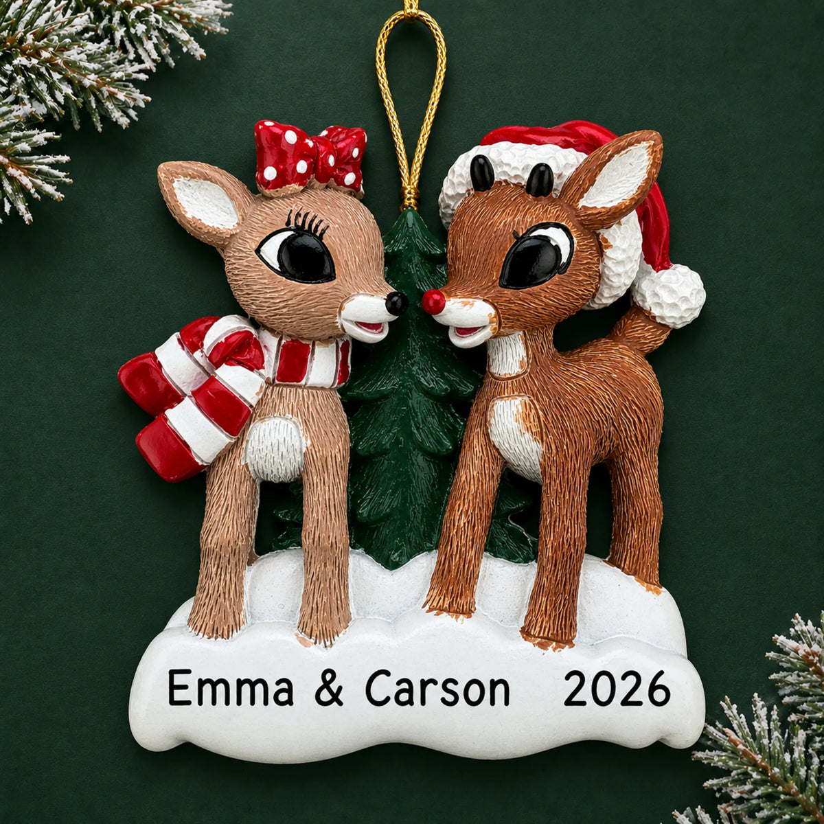 Personalized Rudolph and Clarice christmas ornament on a dark green pine background