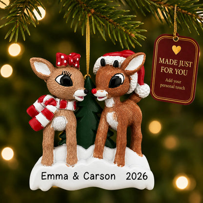 Rudolph and Clarice christmas ornament hanging on a lit Christmas tree with a Made Just For You gift tag