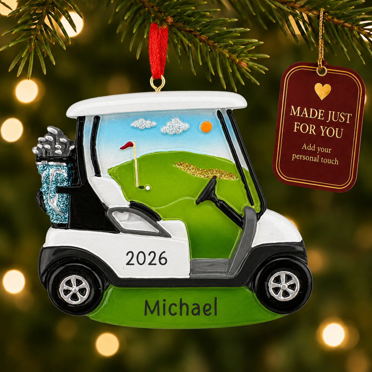 Golf cart christmas ornament hanging on a lit Christmas tree with a Made Just For You gift tag
