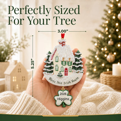 Size guide: the personalized Bless This Irish House christmas ornament is 3.00 in wide by 5.25 in tall, shown in hand