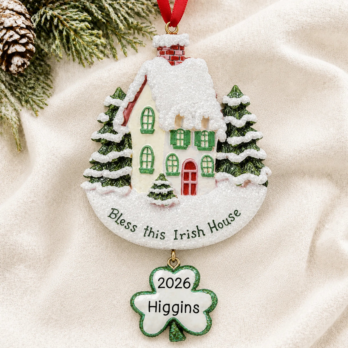 Personalized Bless This Irish House christmas ornament laid on a soft white knit blanket