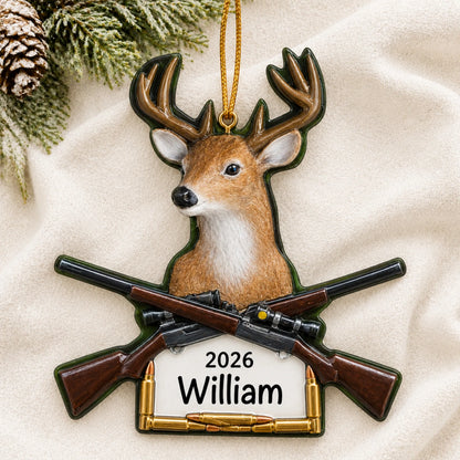 Personalized big buck deer hunting christmas ornament laid on a soft white knit blanket
