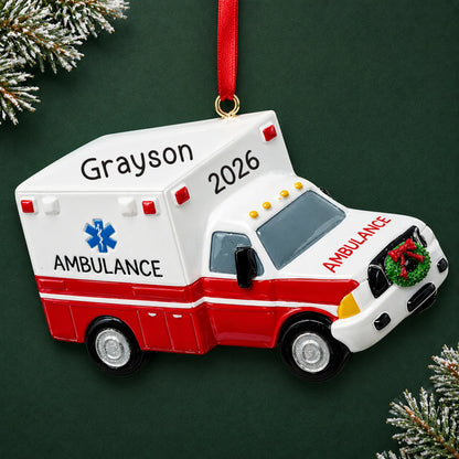 Personalized paramedic ambulance christmas ornament on a dark green pine background