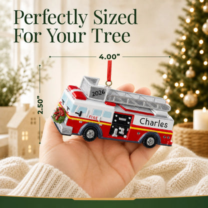 Size guide: the personalized fire truck with ladder christmas ornament is 4.00 in wide by 2.50 in tall, shown in hand