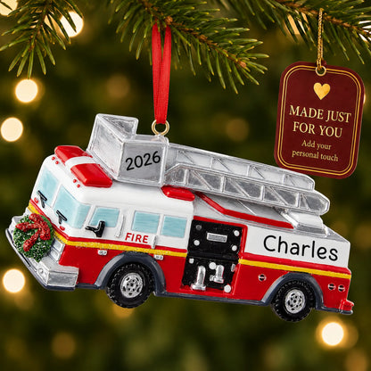 Fire truck with ladder christmas ornament hanging on a lit Christmas tree with a Made Just For You gift tag