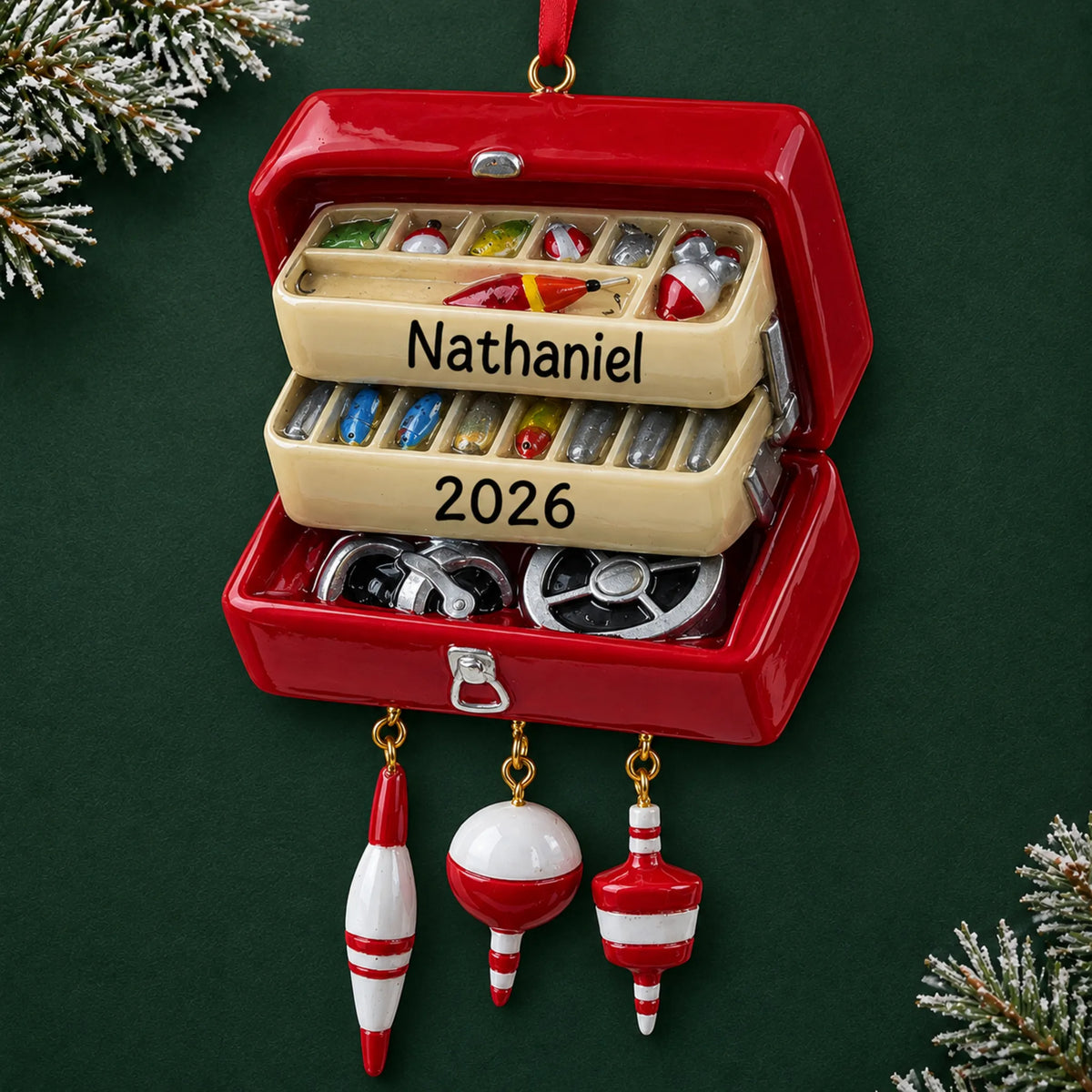 Personalized fishing tackle box christmas ornament on a dark green pine background