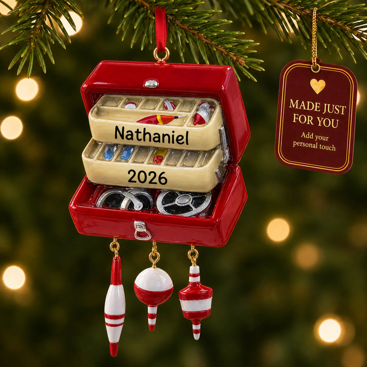 Fishing tackle box christmas ornament hanging on a lit Christmas tree with a Made Just For You gift tag
