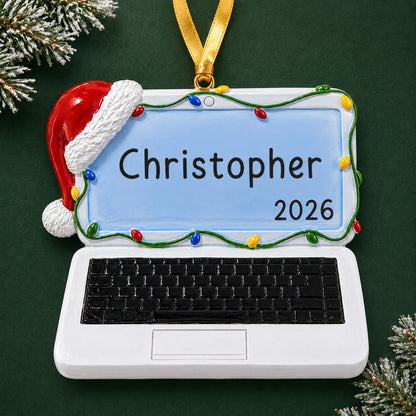 Personalized laptop computer christmas ornament on a dark green pine background
