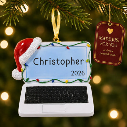 Laptop computer christmas ornament hanging on a lit Christmas tree with a Made Just For You gift tag