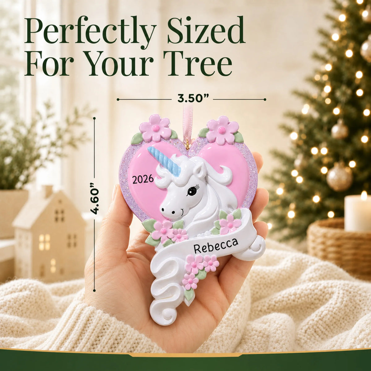 Size guide: the personalized unicorn heart christmas ornament is 3.50 in wide by 4.60 in tall, shown in hand