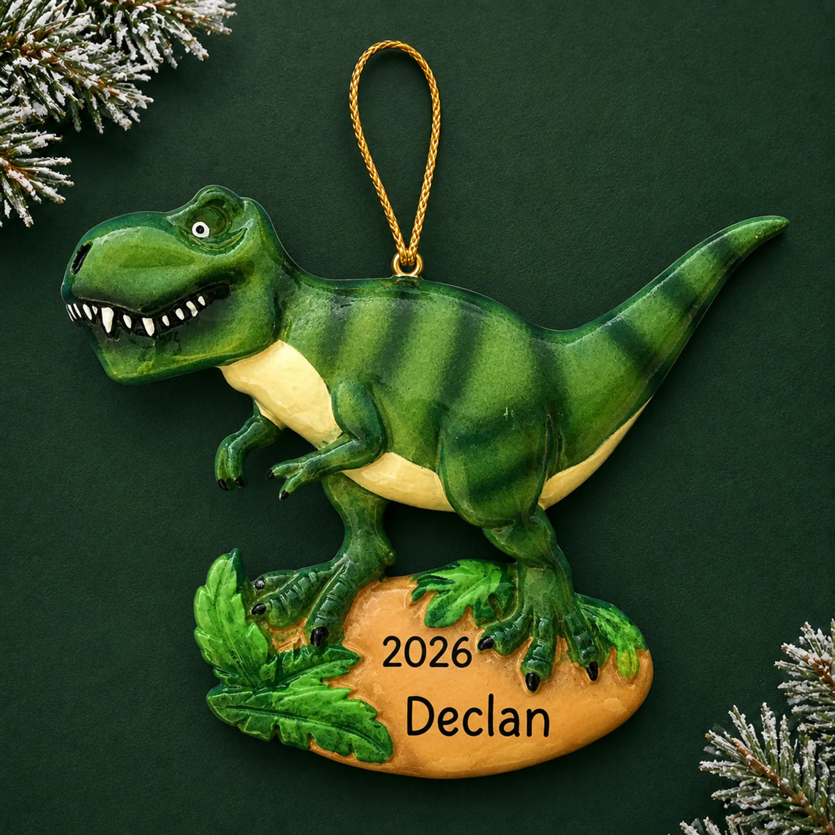 Personalized t-rex dinosaur christmas ornament on a dark green pine background