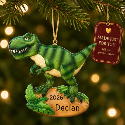 T-rex dinosaur christmas ornament hanging on a lit Christmas tree with a Made Just For You gift tag