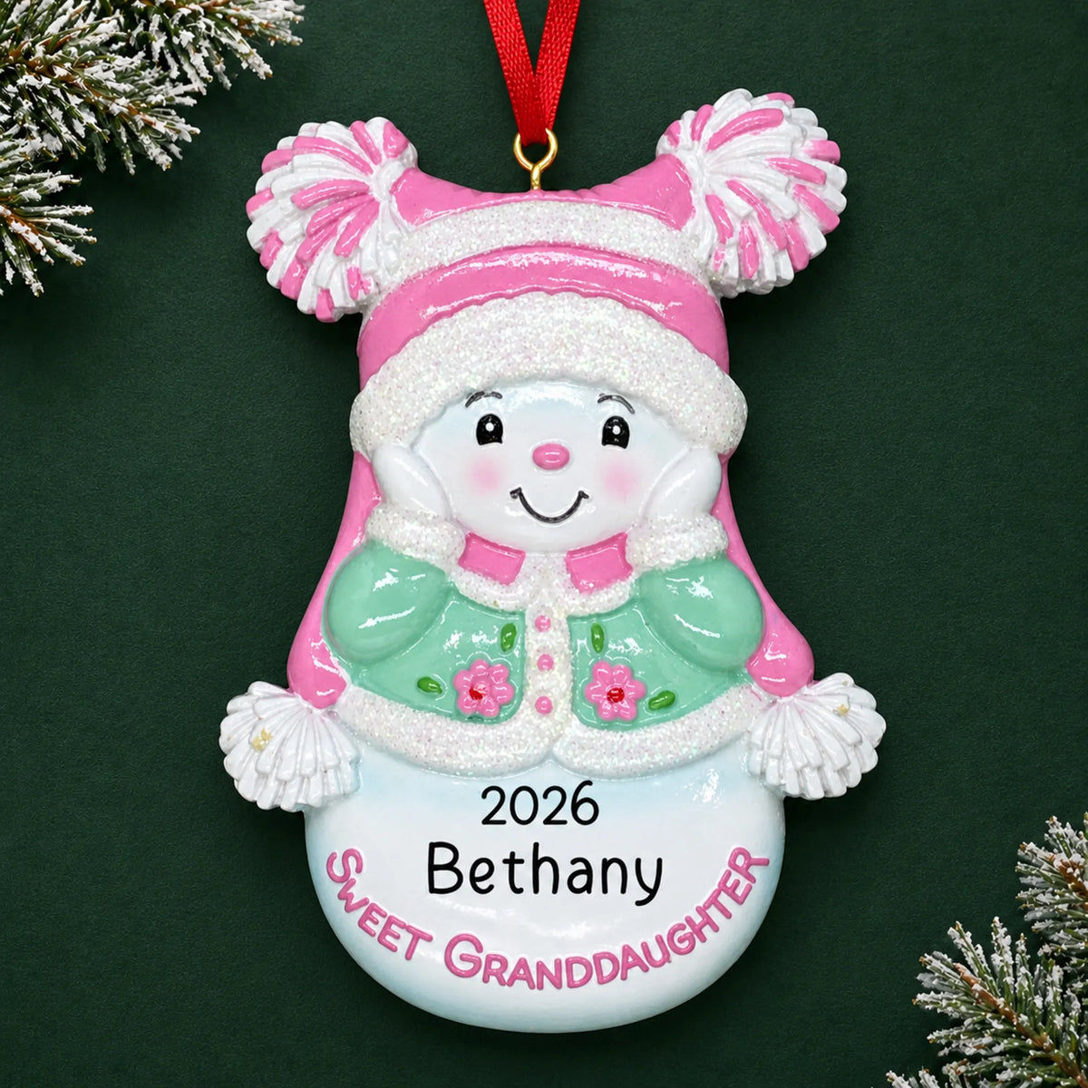 Personalized sweet granddaughter christmas ornament on a dark green pine background