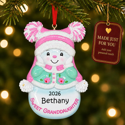 Sweet granddaughter christmas ornament hanging on a lit Christmas tree with a Made Just For You gift tag