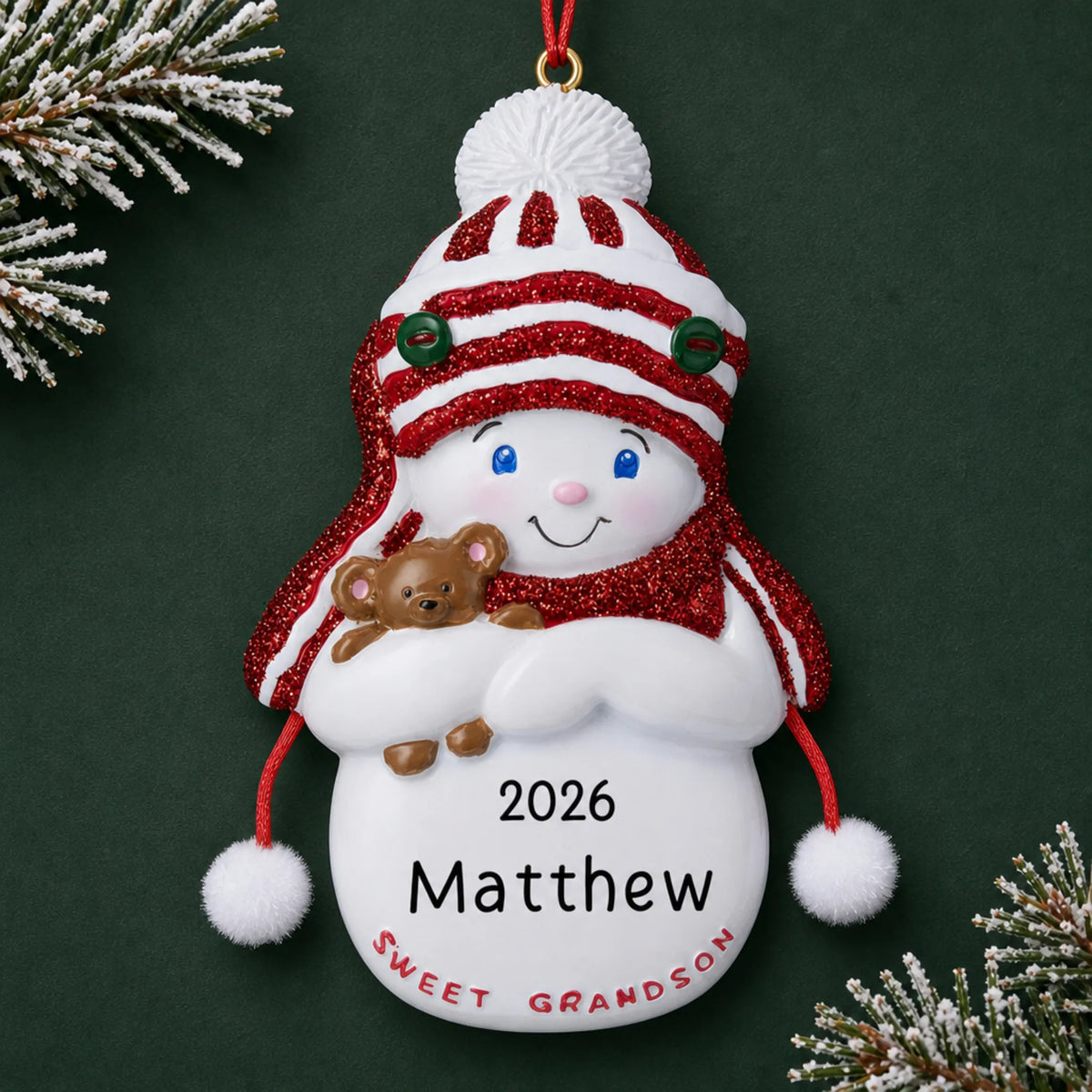 Personalized sweet grandson christmas ornament on a dark green pine background