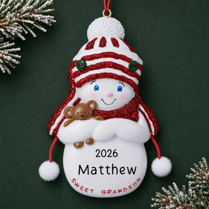 Personalized sweet grandson christmas ornament on a dark green pine background
