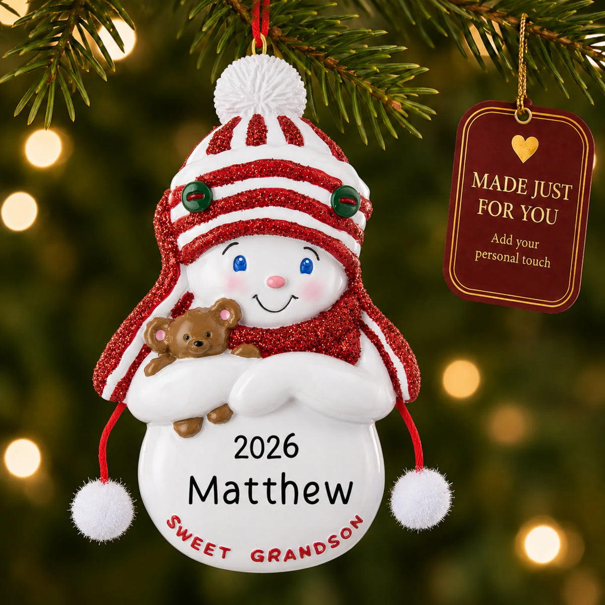 Sweet grandson christmas ornament hanging on a lit Christmas tree with a Made Just For You gift tag