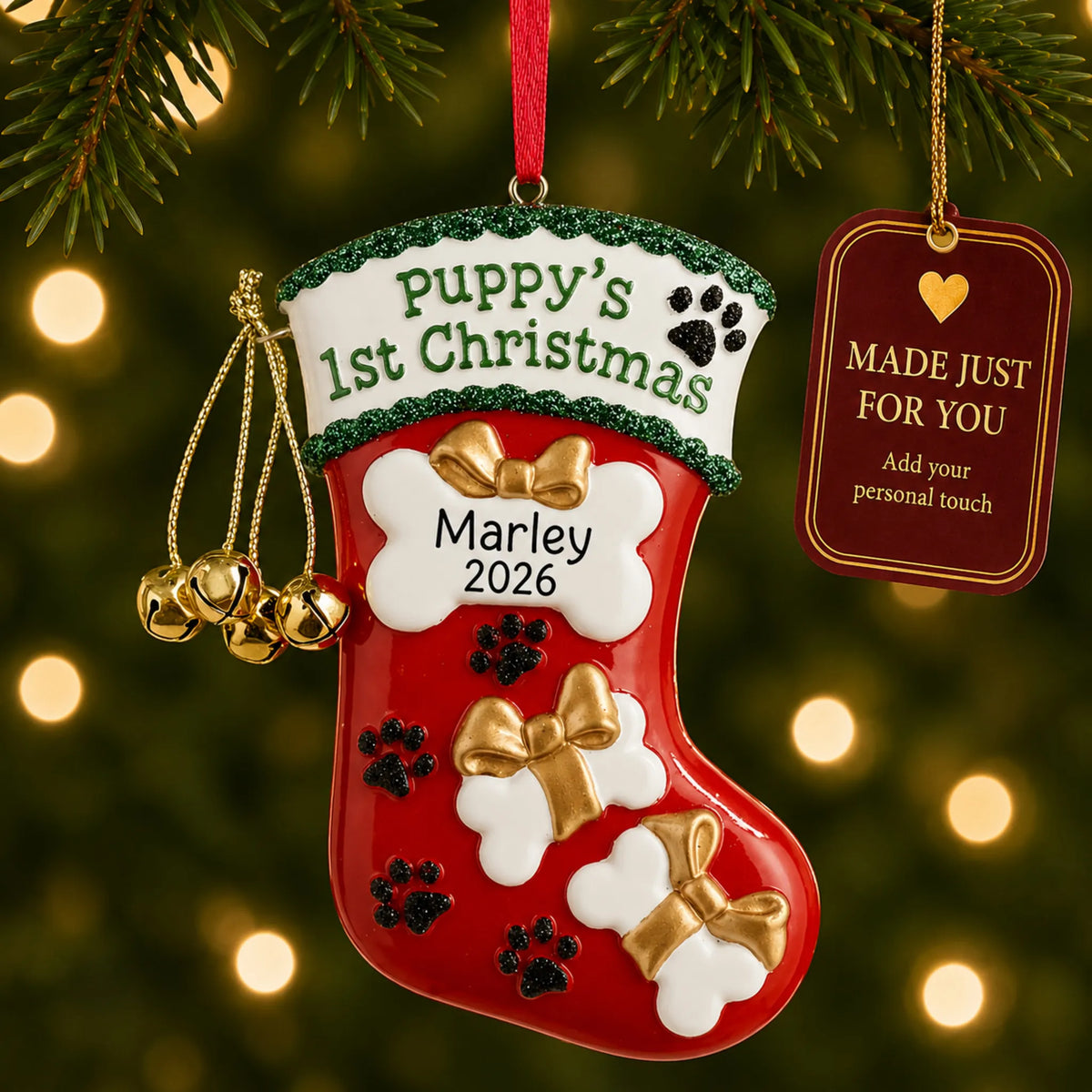 Puppy's First Christmas Stocking ornament hanging on a lit Christmas tree with a Made Just For You gift tag