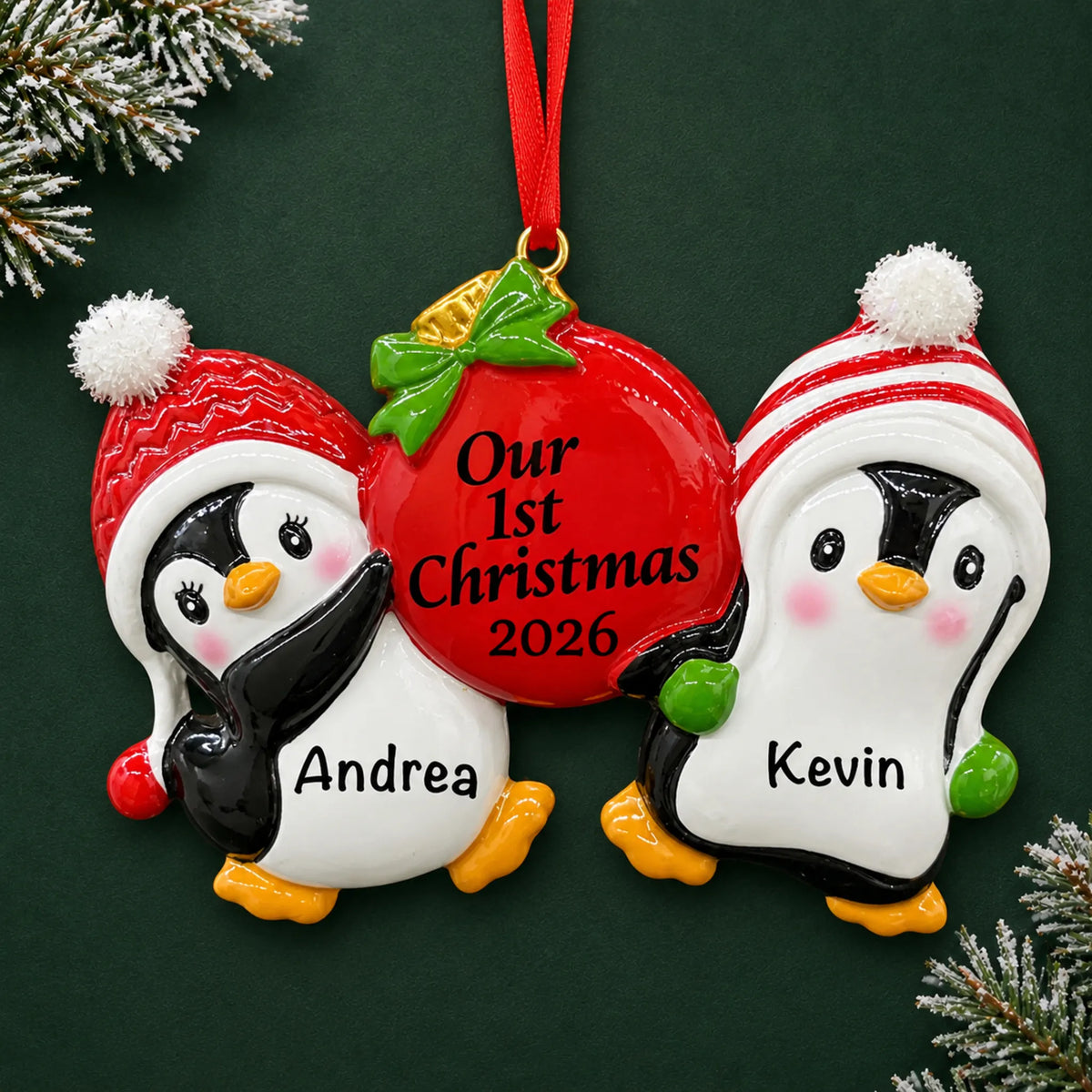 Personalized our first christmas penguins ornament on a dark green pine background