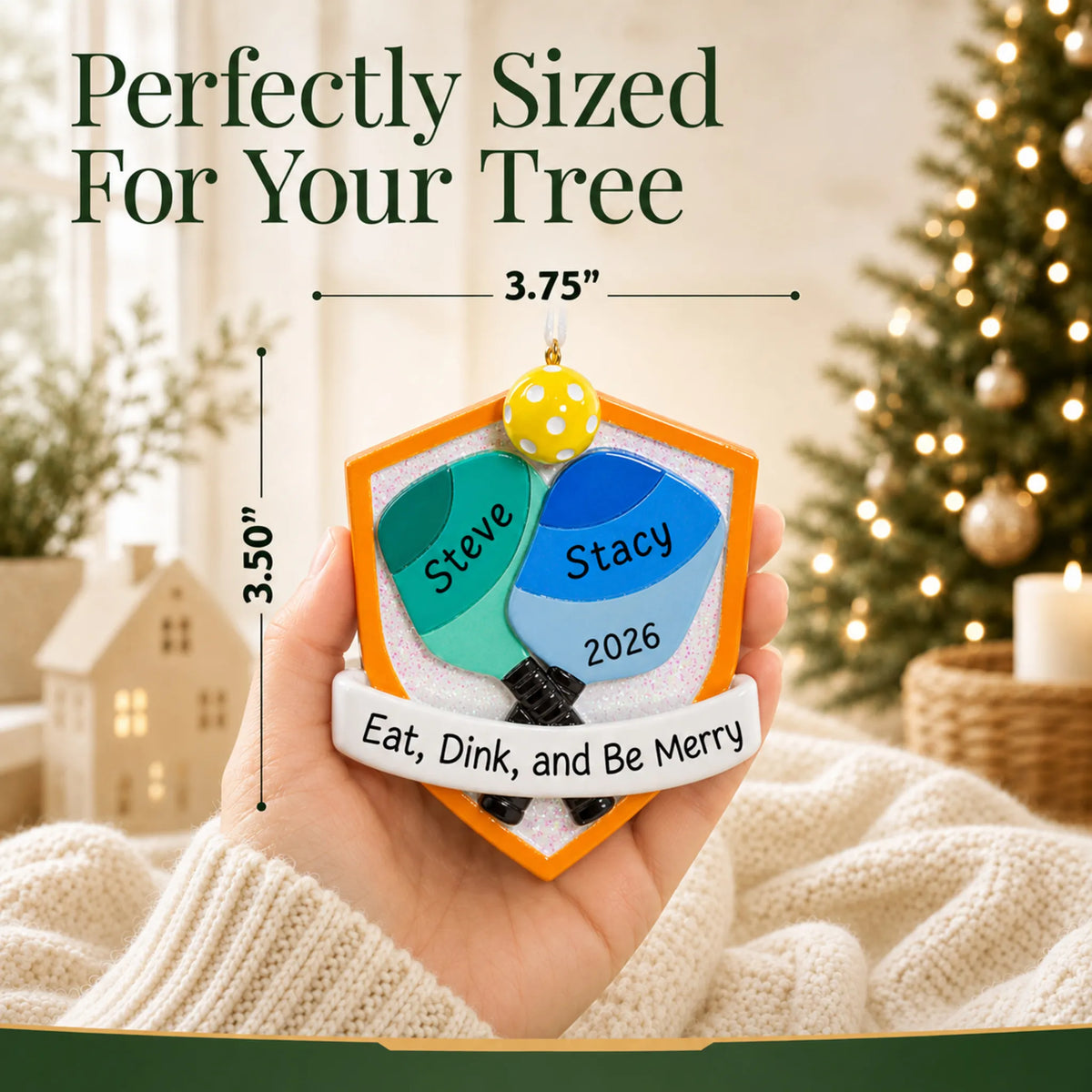 Size guide: the personalized pickleball doubles christmas ornament shown in hand next to a Christmas tree