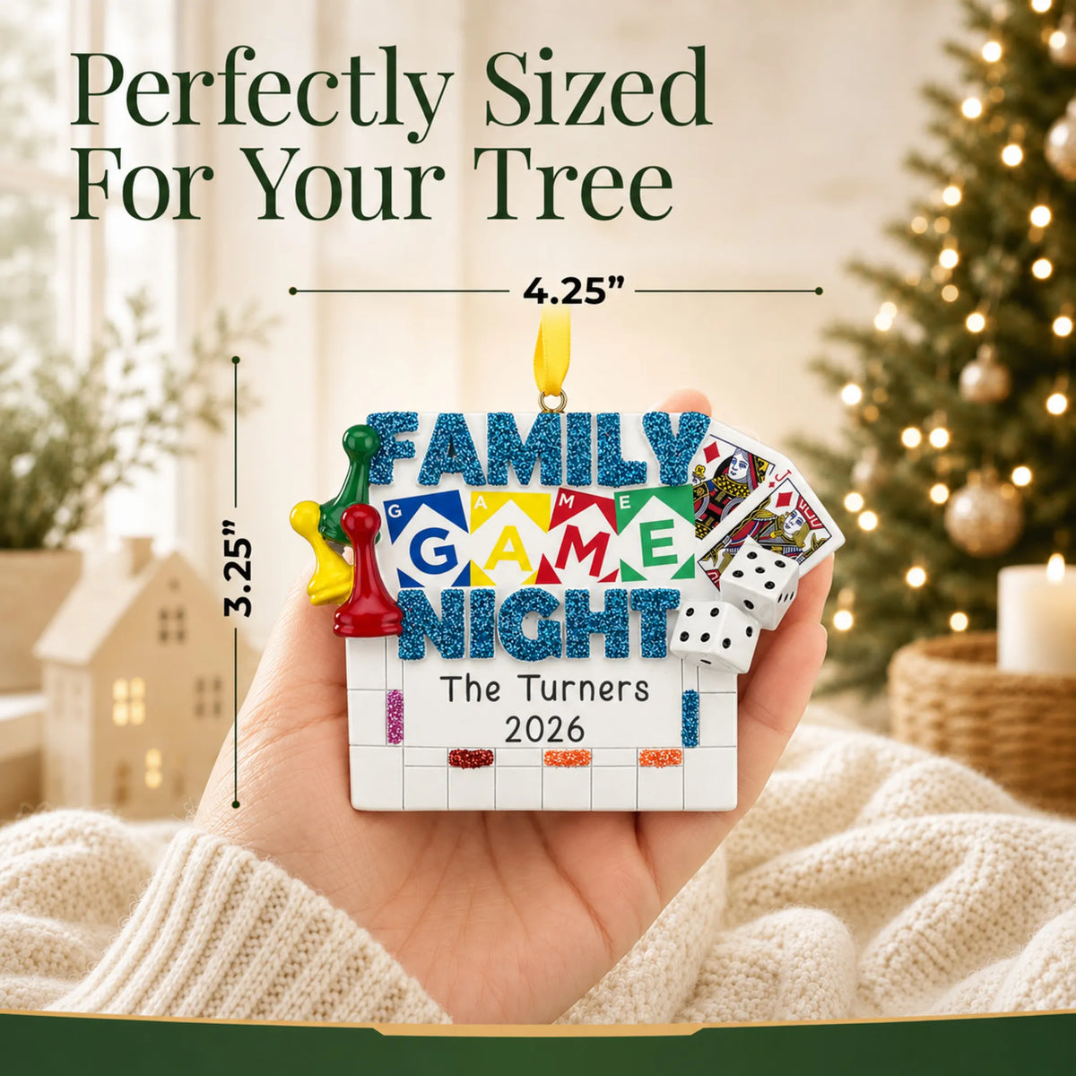 Size guide: the personalized family game night christmas ornament is 4.25 in wide by 3.25 in tall, shown in hand