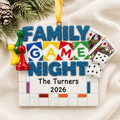 Personalized family game night christmas ornament laid on a soft white knit blanket
