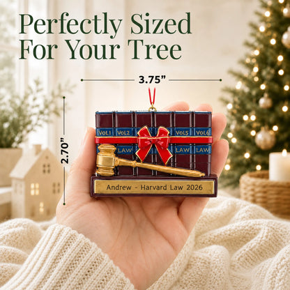 Size guide: the personalized attorney law and gavel christmas ornament is 3.75 in wide by 2.70 in tall, shown in hand