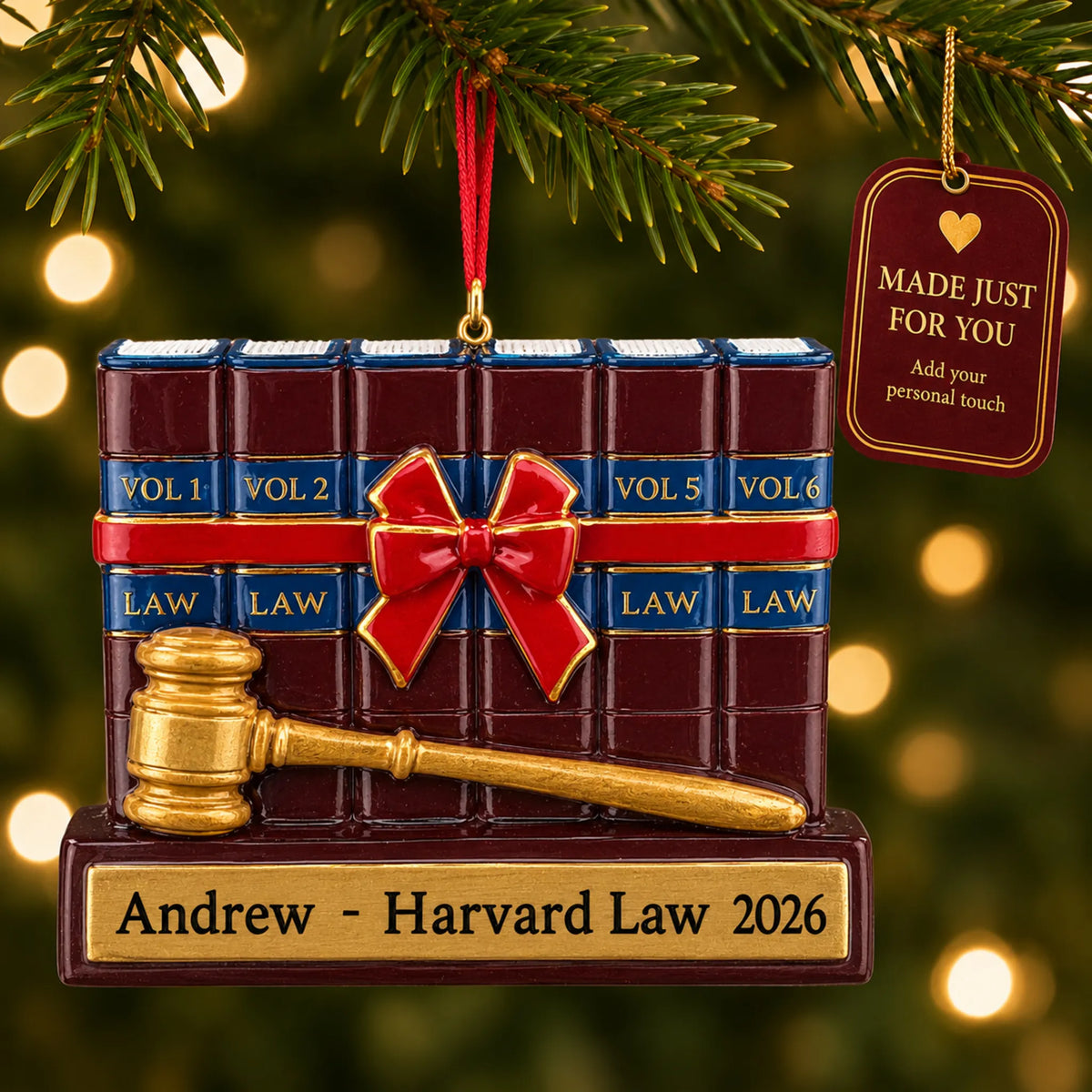 Attorney law and gavel christmas ornament hanging on a lit Christmas tree with a Made Just For You gift tag